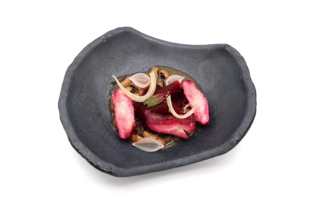 Caro Hotel Valencia Luaran gambar A plate of octopus sashimi